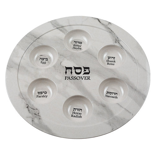Marble-patterned Passover Seder plate with Hebrew text on a white background