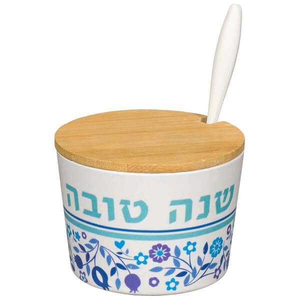 Natural bamboo honey dish engraved with Shana Tovah in Hebrew for Rosh Hashanah.