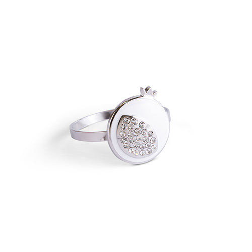 Close-up of silver pomegranate napkin holder with sparkling accents